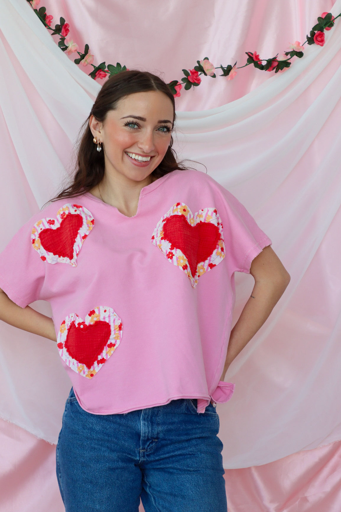 girl wearing pink heart tshirt