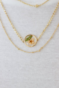 gold chain layered necklace with resin flower charm