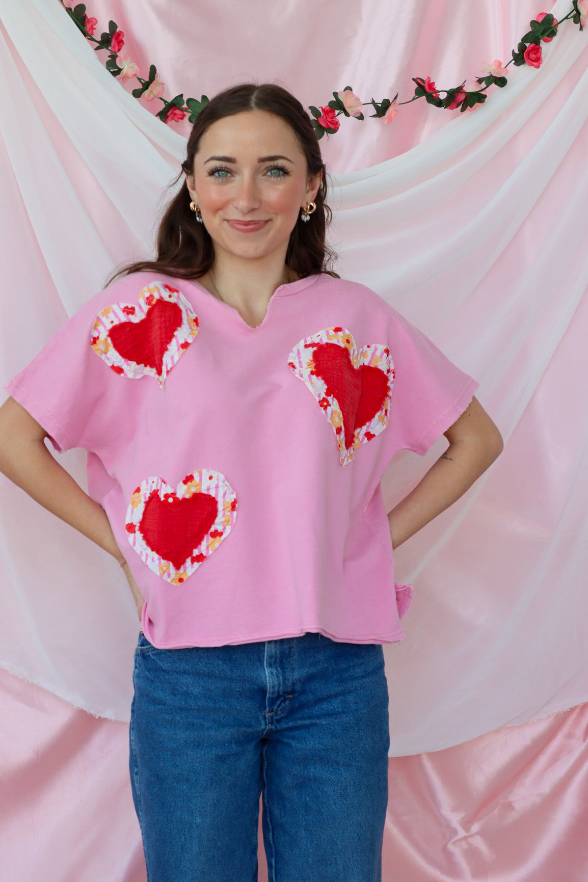 girl wearing pink heart tshirt