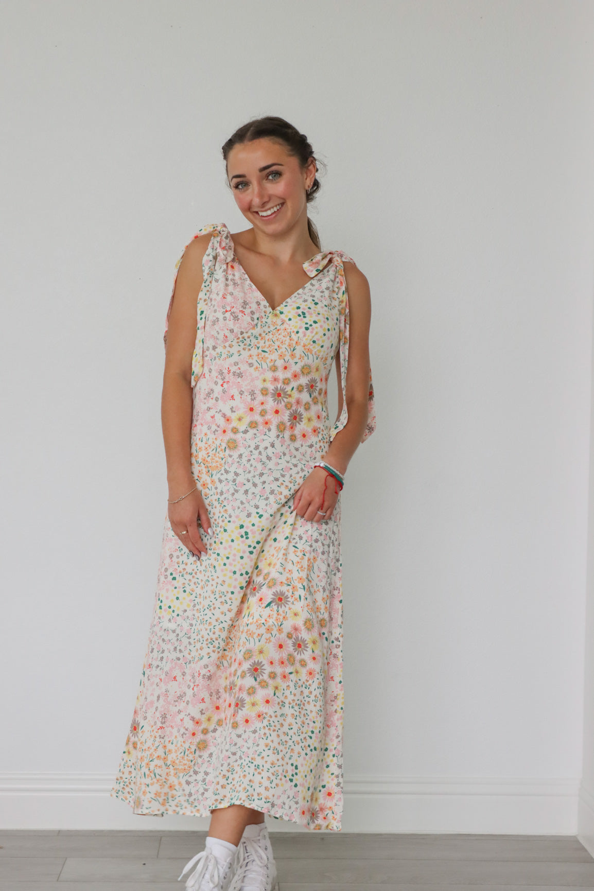 girl wearing pastel floral long dress