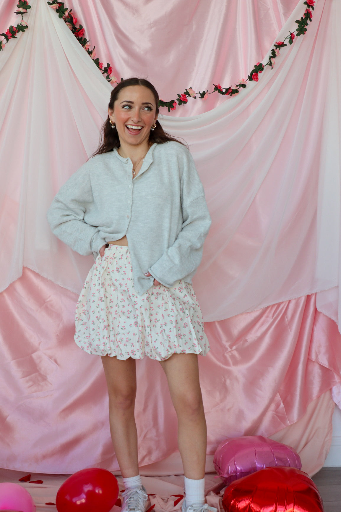 girl wearing white floral bubble skirt