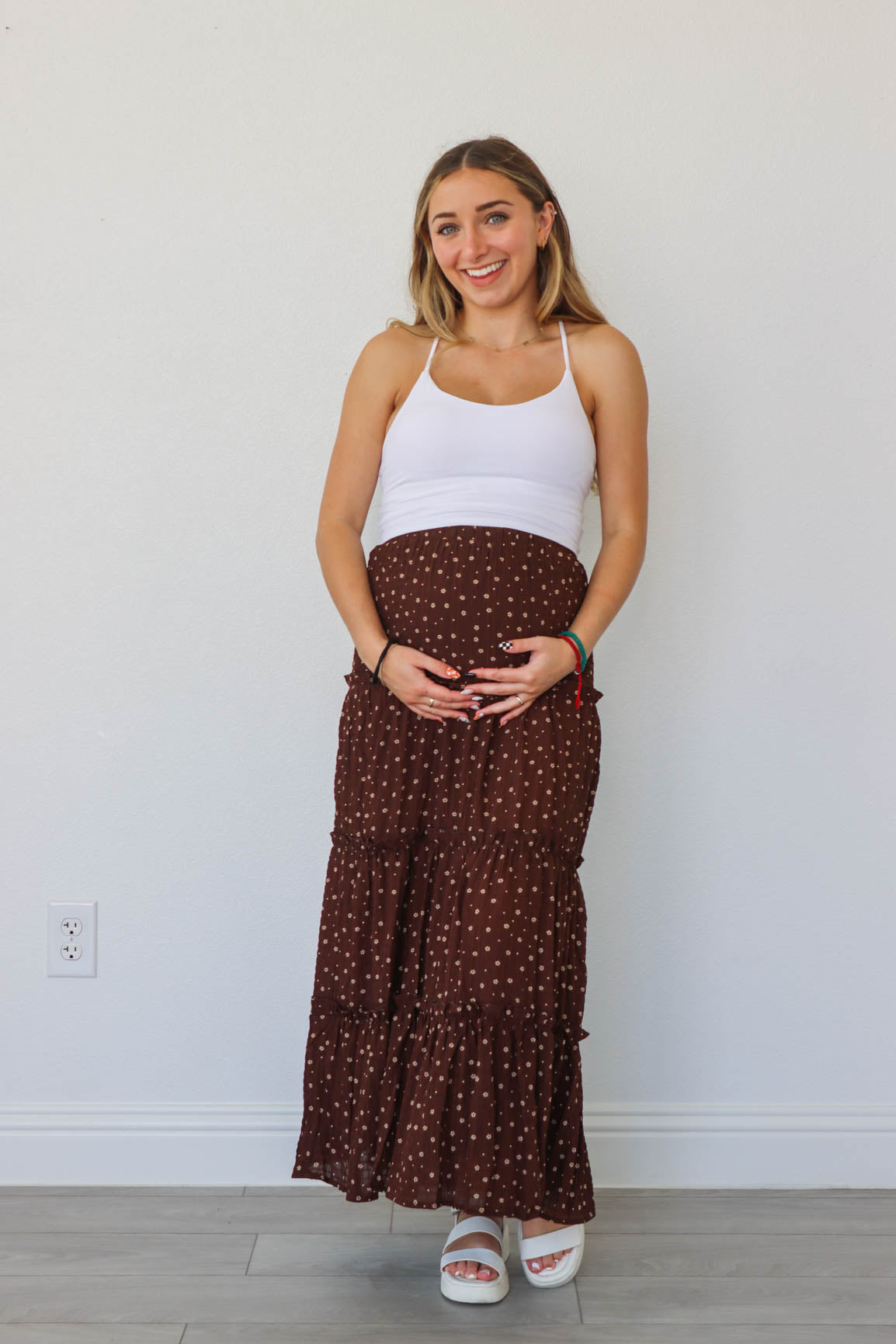 girl wearing dark brown floral maxi skirt