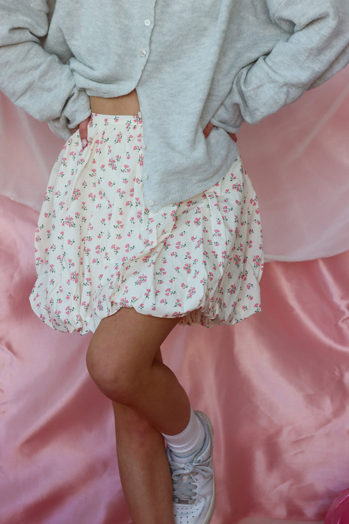 girl wearing white floral bubble skirt