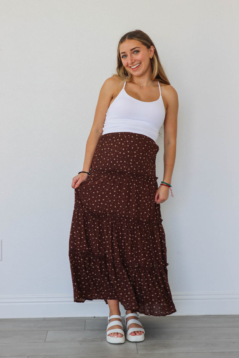 girl wearing dark brown floral maxi skirt