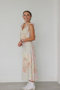 girl wearing pastel floral long dress