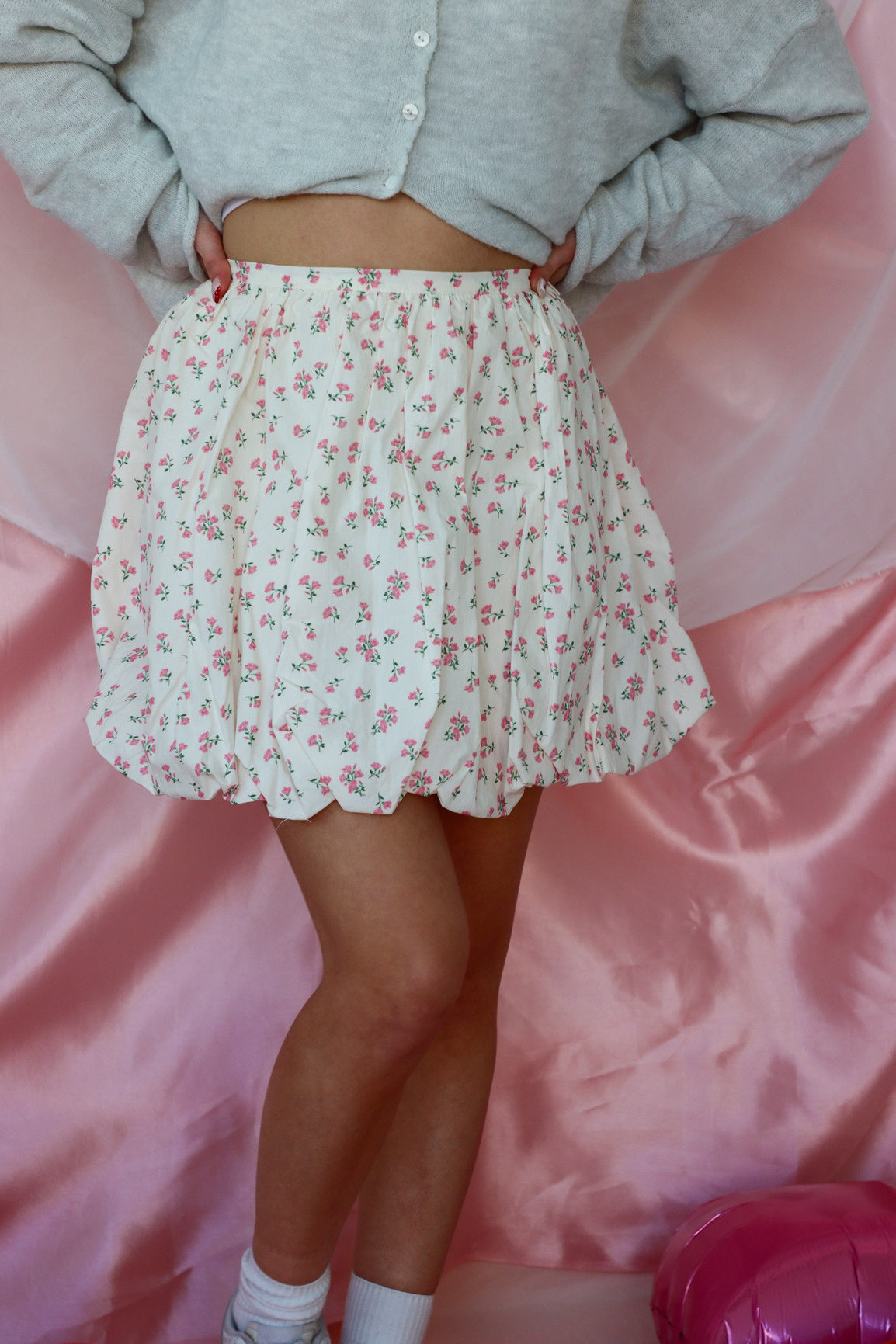 girl wearing white floral bubble skirt