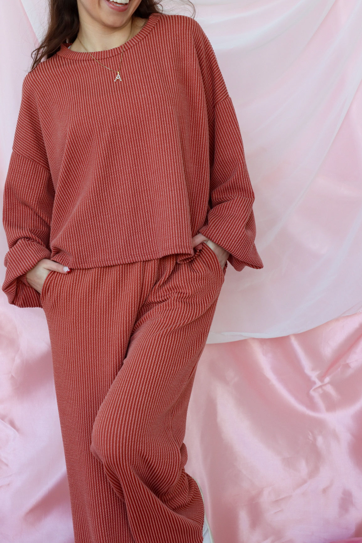 girl wearing red ribbed matching lounge set