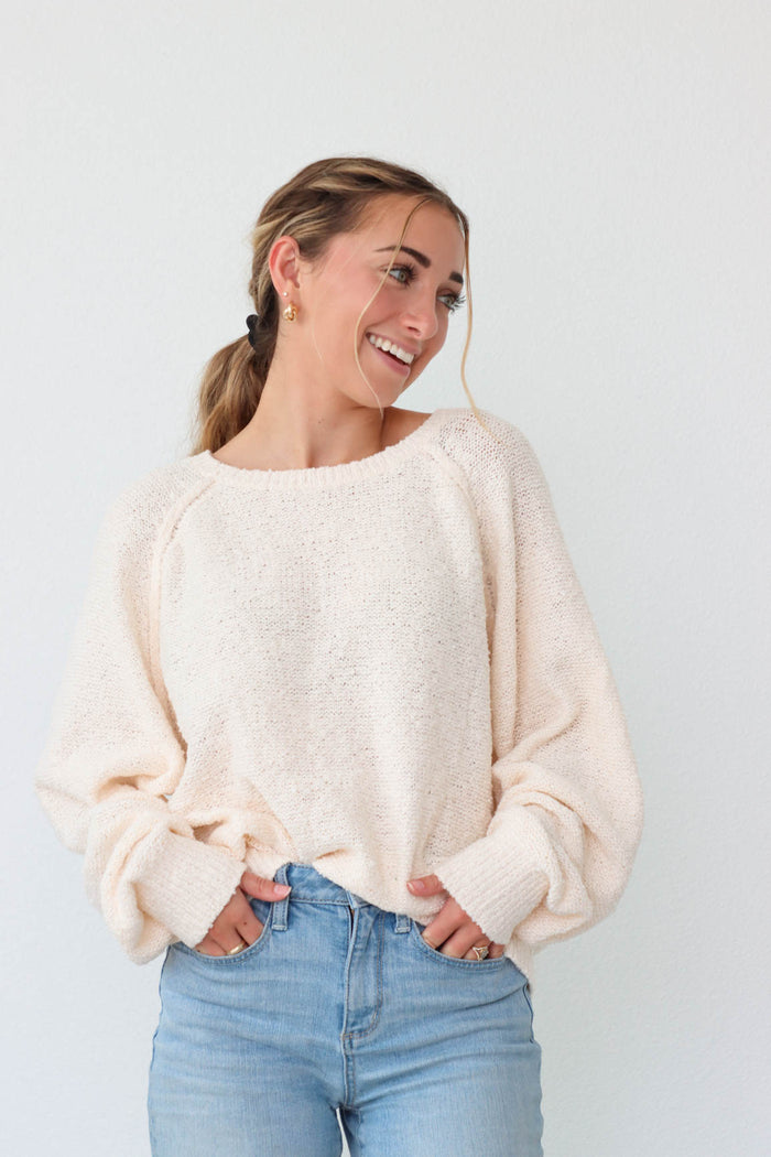 girl wearing cream boucle sweater