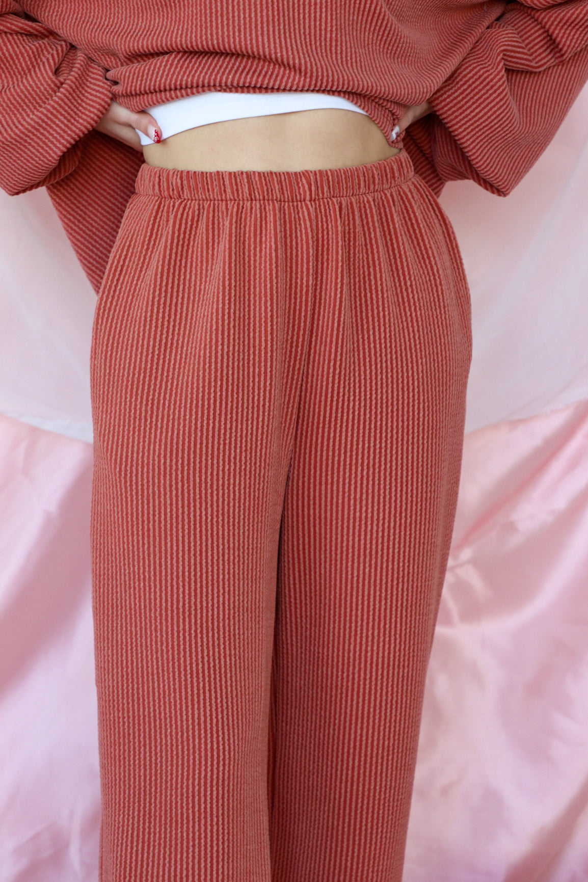 girl wearing red ribbed matching lounge set