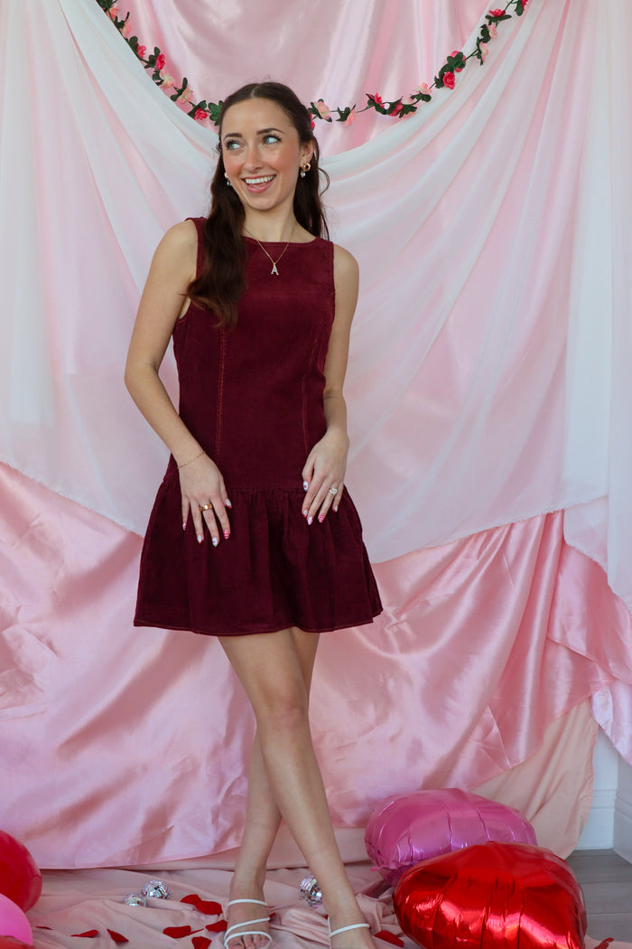 girl wearing maroon dress