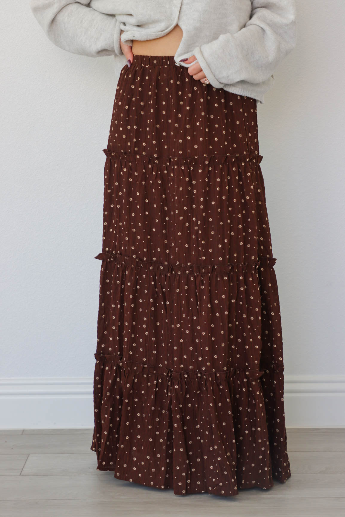 girl wearing dark brown floral maxi skirt