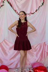 girl wearing maroon dress