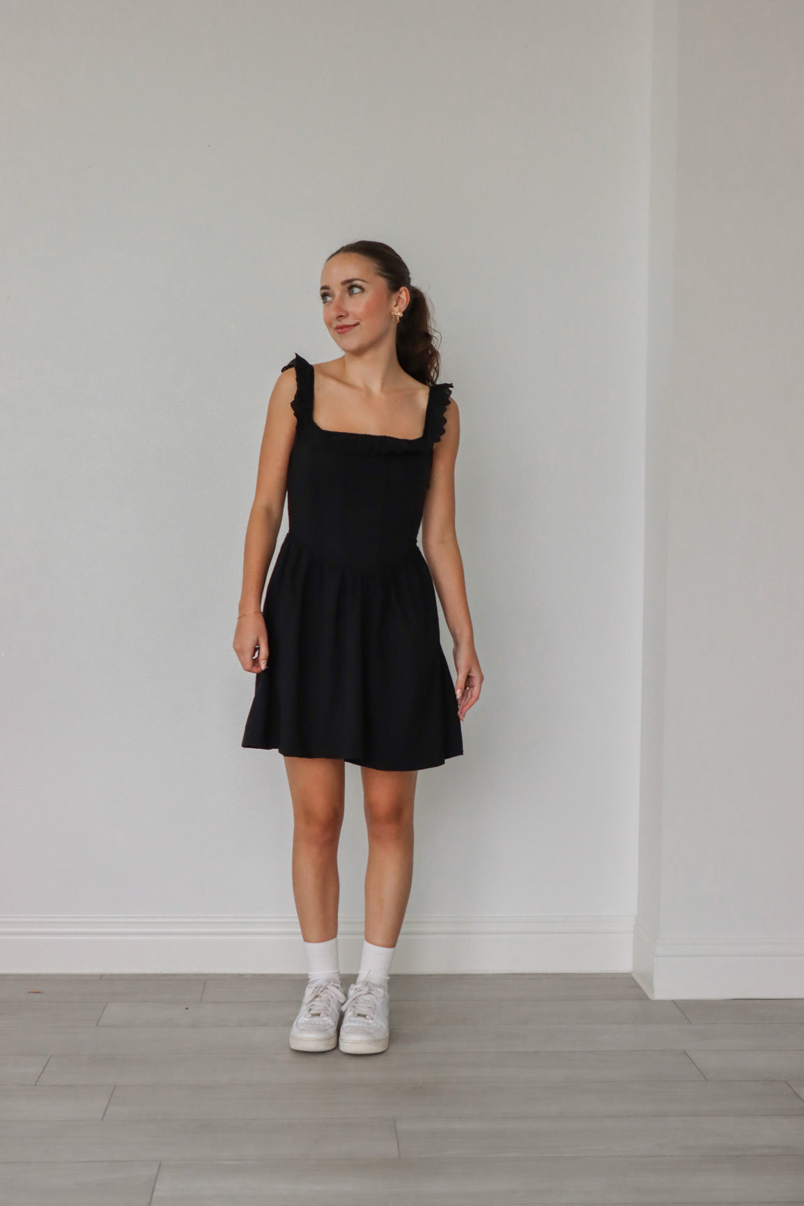 girl wearing short black dress