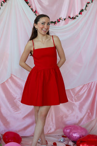 girl wearing red short dress