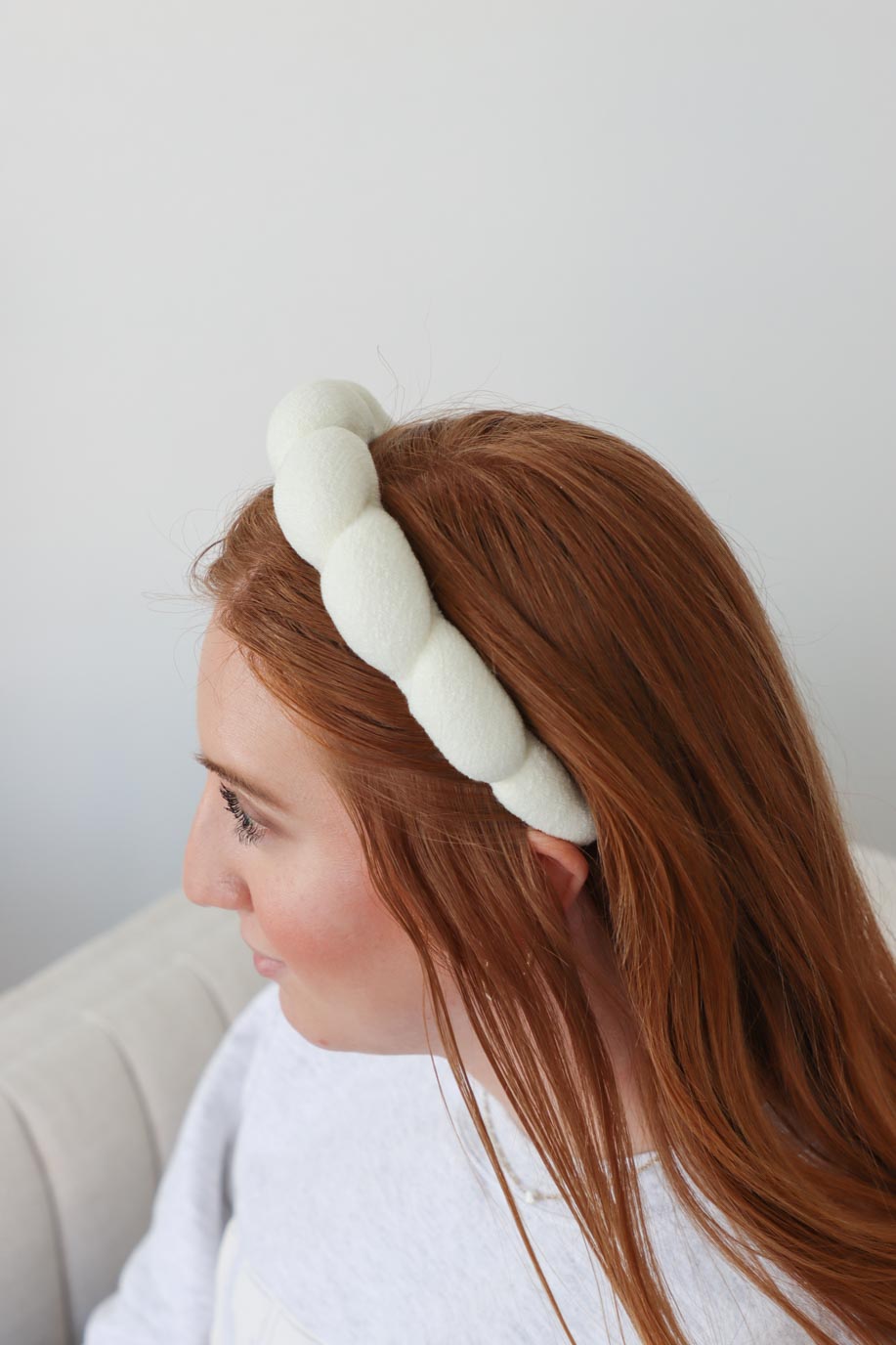girl wearing white terry cloth headband