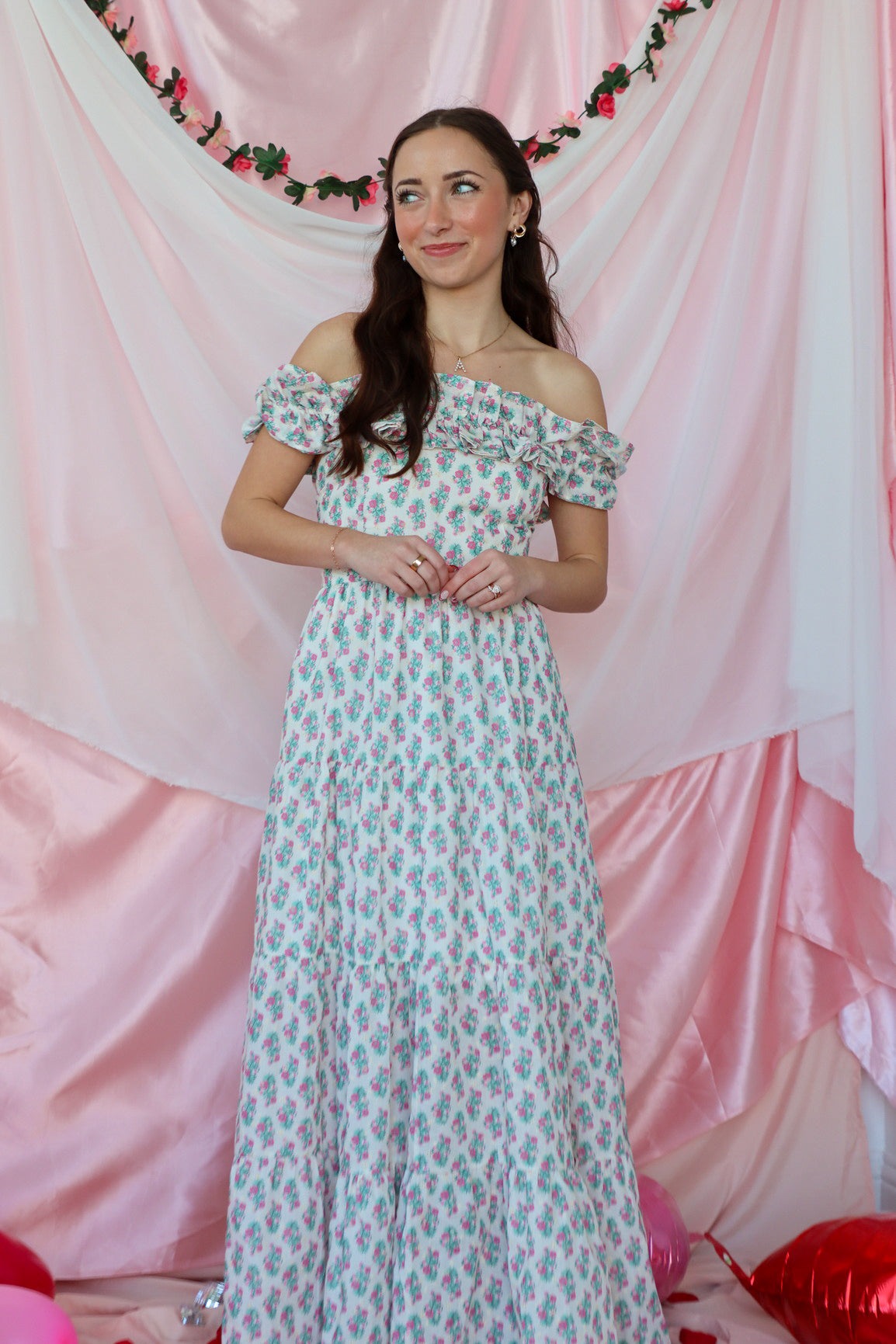 girl wearing white floral maxi dress