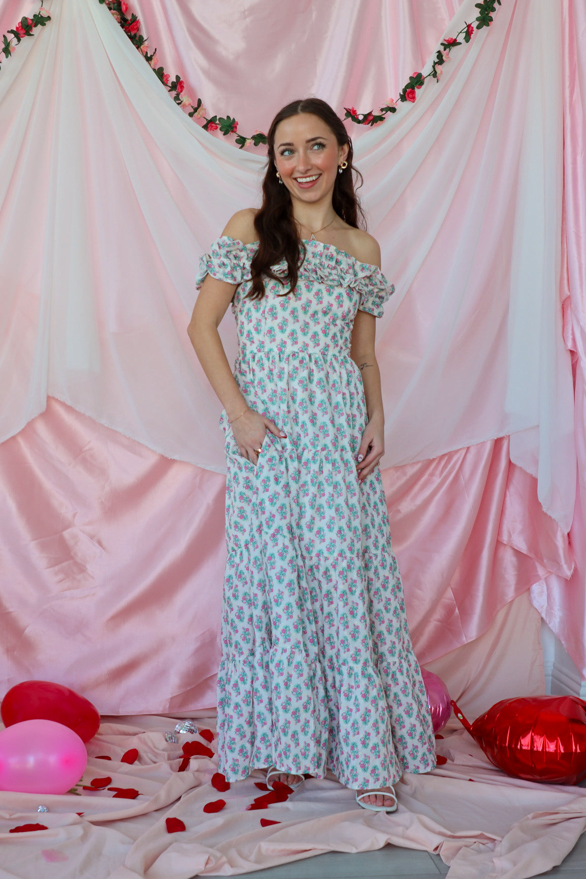 girl wearing white floral maxi dress