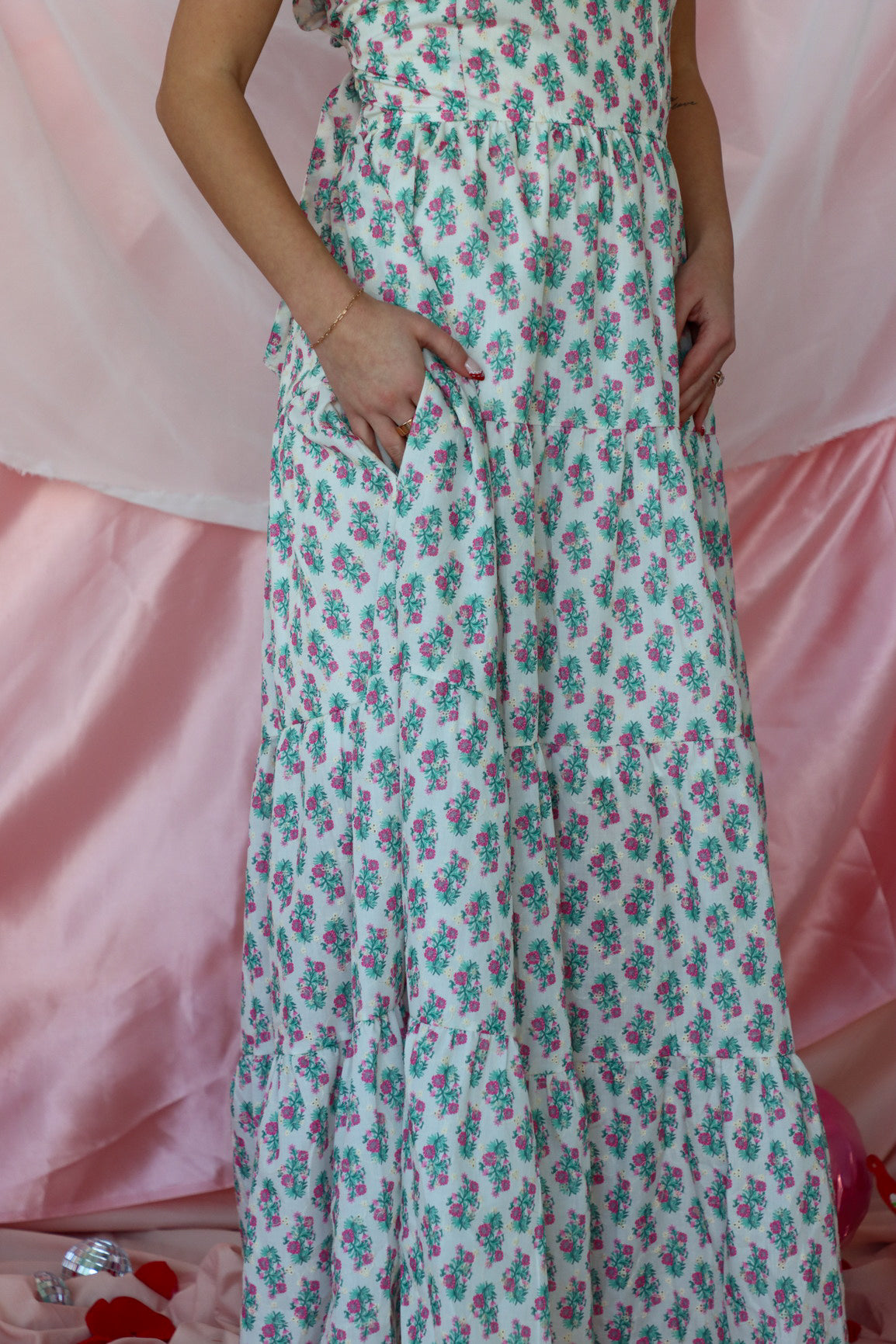 girl wearing white floral maxi dress