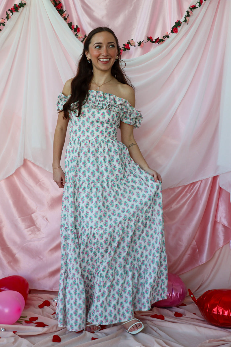 girl wearing white floral maxi dress