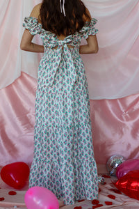 girl wearing white floral maxi dress