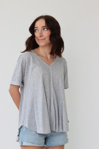girl wearing gray t-shirt with exposed seam detailing
