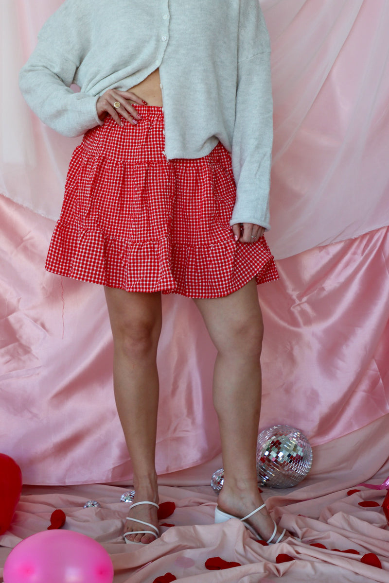 girl wearing red plaid skirt