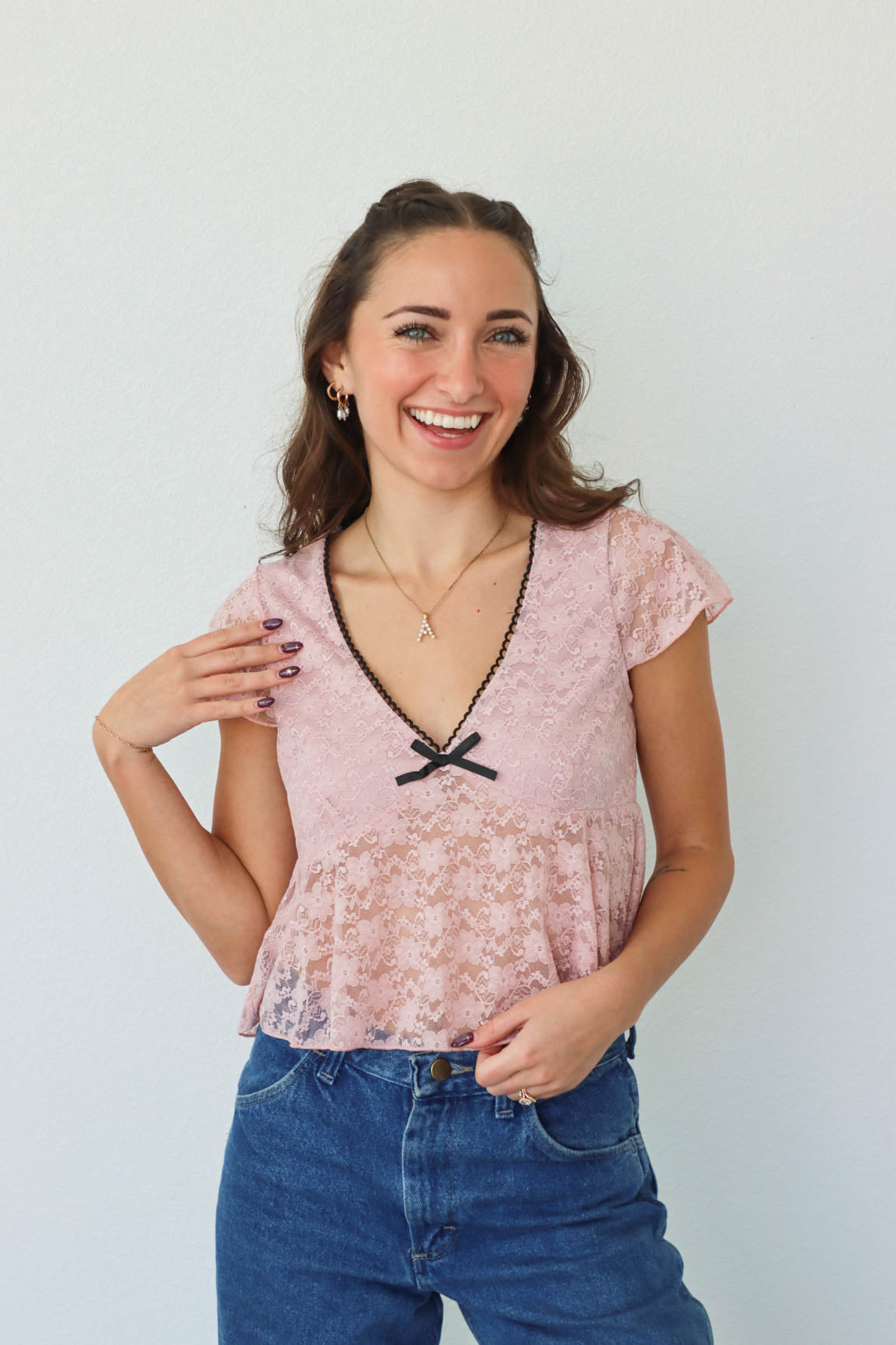 girl wearing pink lace top