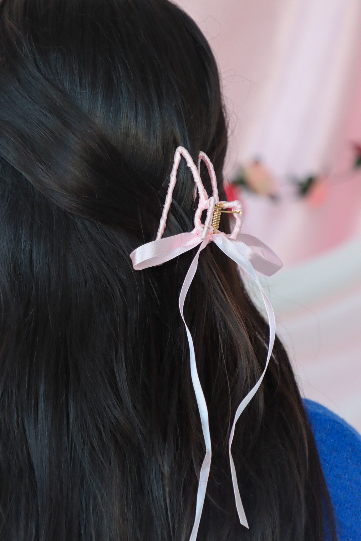 girl wearing pink silk hair bow clip