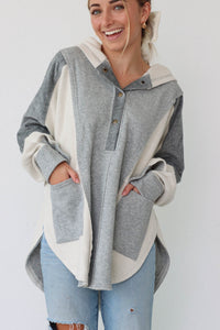girl wearing gray oversized hoodie