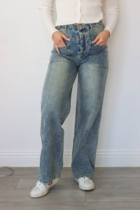 girl wearing medium washed jeans