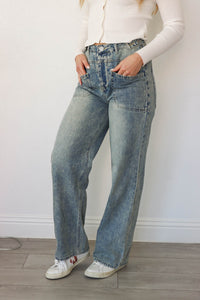 girl wearing medium washed jeans