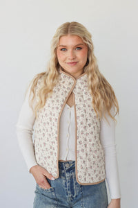 girl wearing cream quilt vest