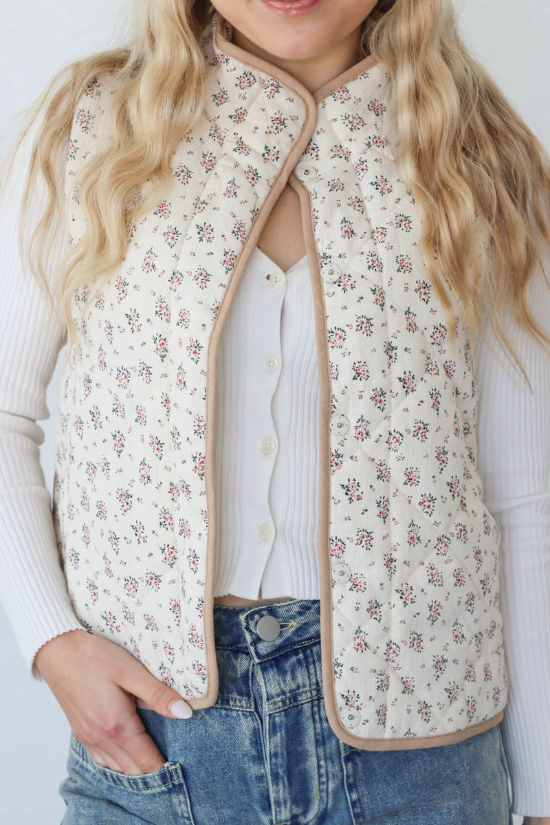 girl wearing cream quilt vest