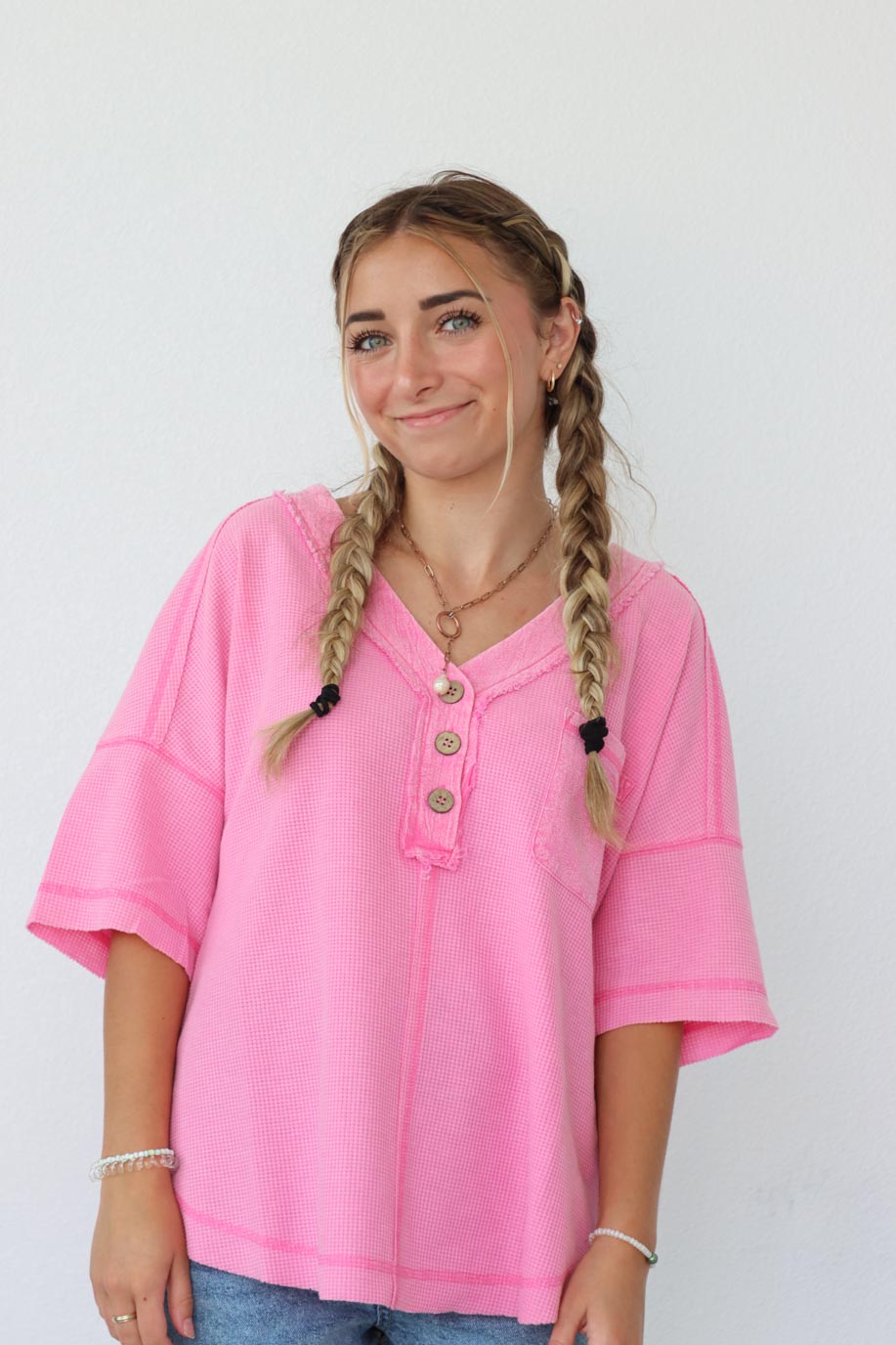 girl wearing hot pink waffle knit t-shirt
