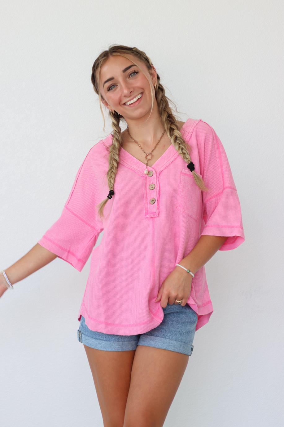 girl wearing hot pink waffle knit t-shirt