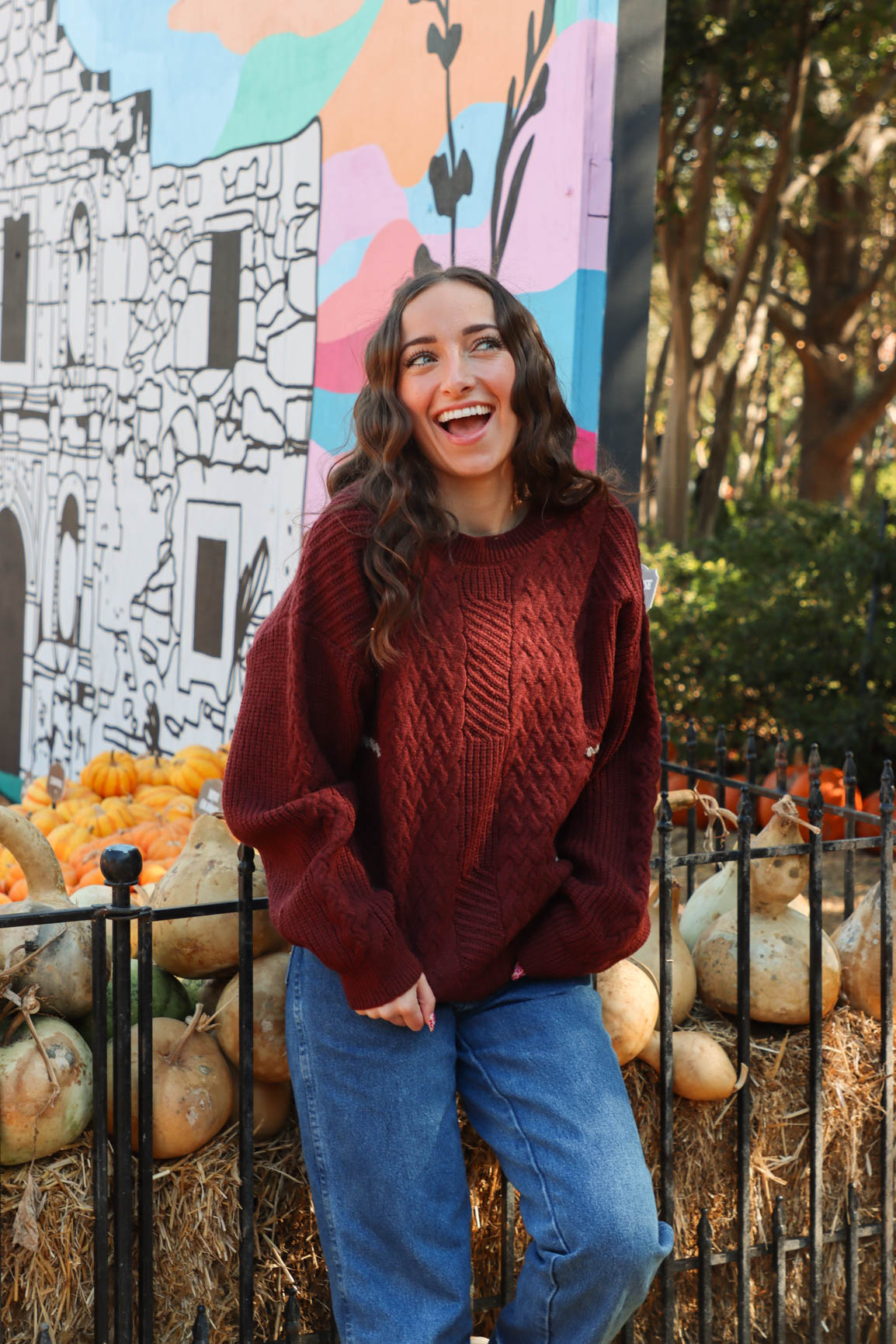 girl wearing dark red knit sweater