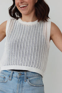 girl wearing white crochet knit tank top