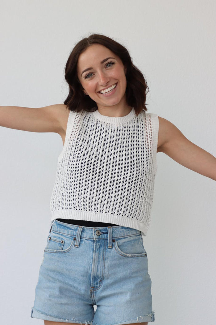 girl wearing white crochet knit tank top