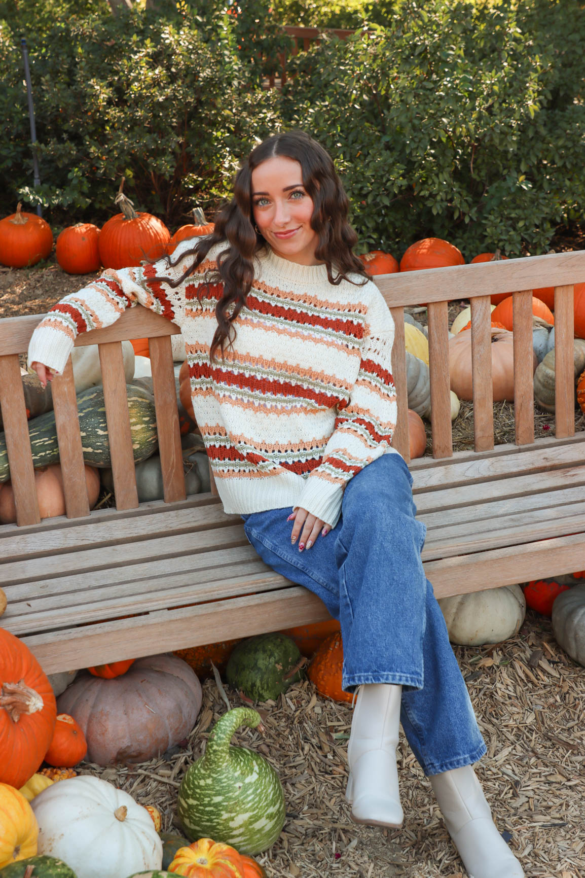 girl wearing cream multicolored knit sweater