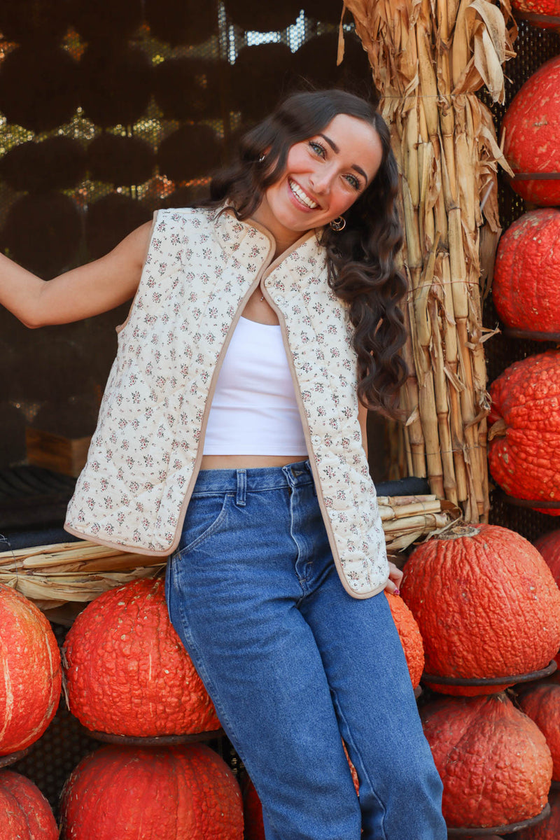 girl wearing cream quilt vest