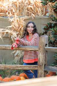 girl wearing orange striped top