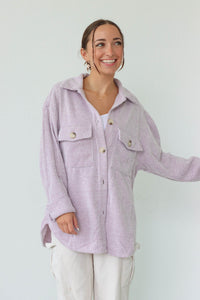 girl wearing light purple flannel jacket