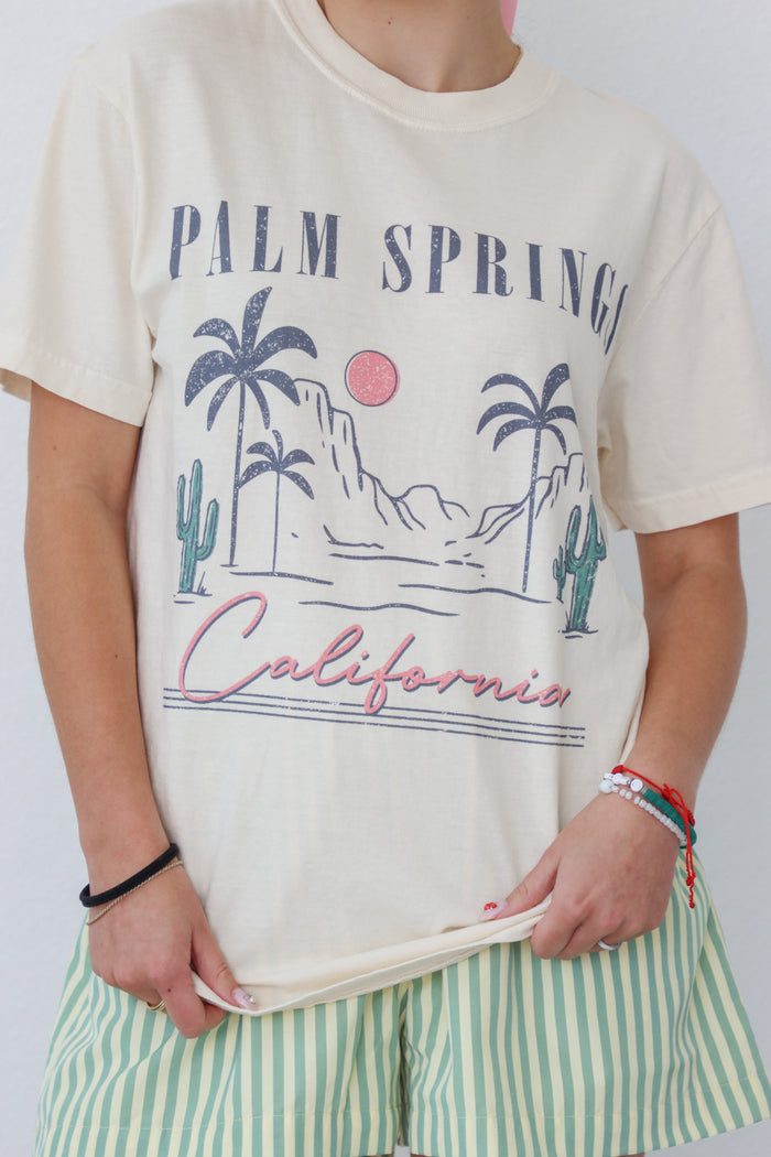 girl wearing cream "Palm Spring California" graphic tee