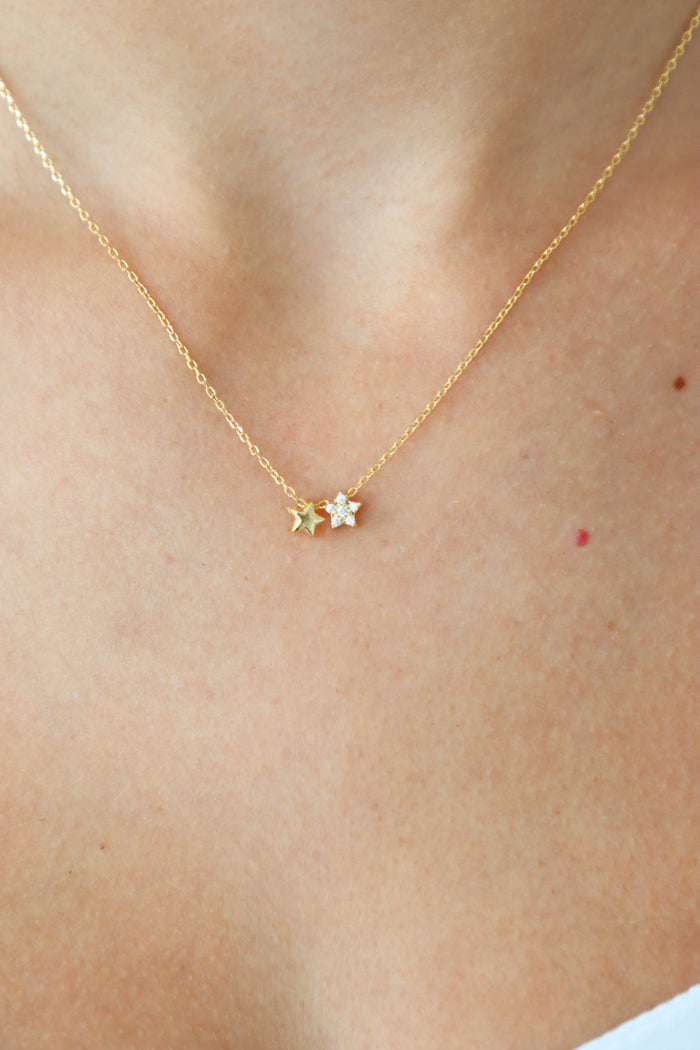 gold necklace with two star charms