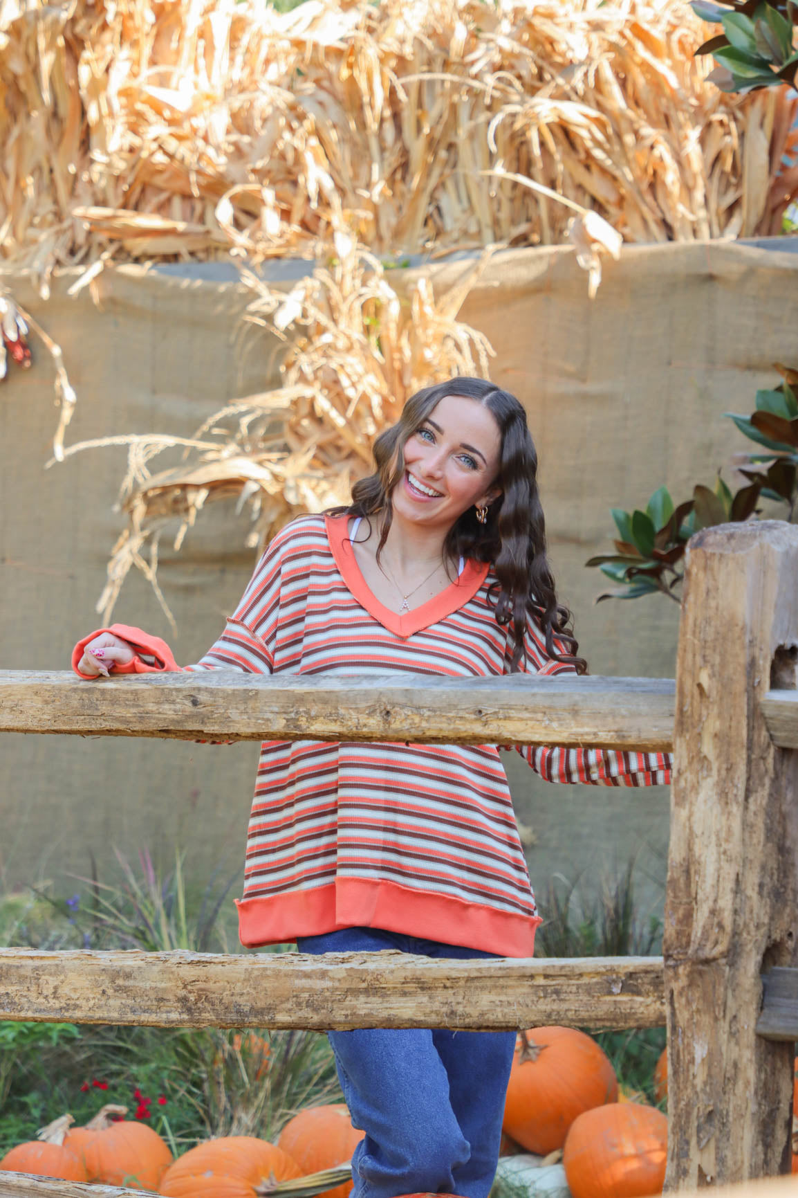 girl wearing orange striped top