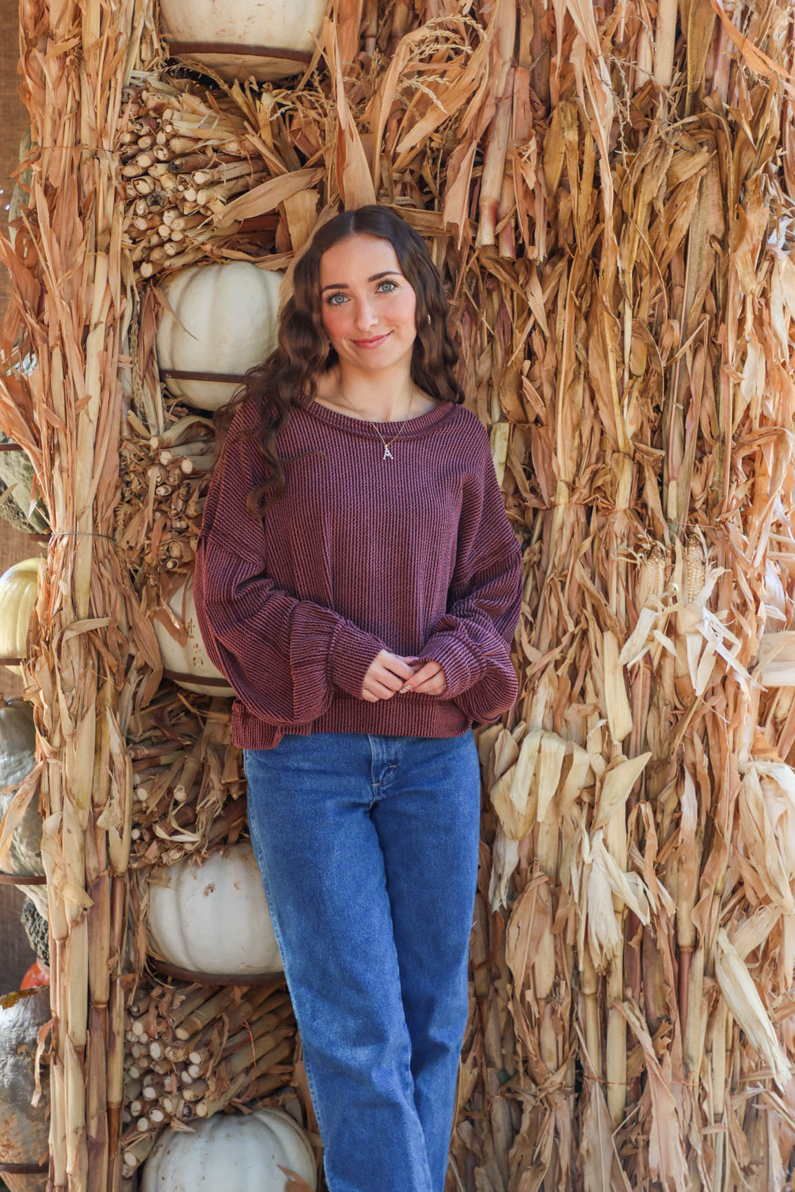 girl wearing dark red ribbed long sleeve top