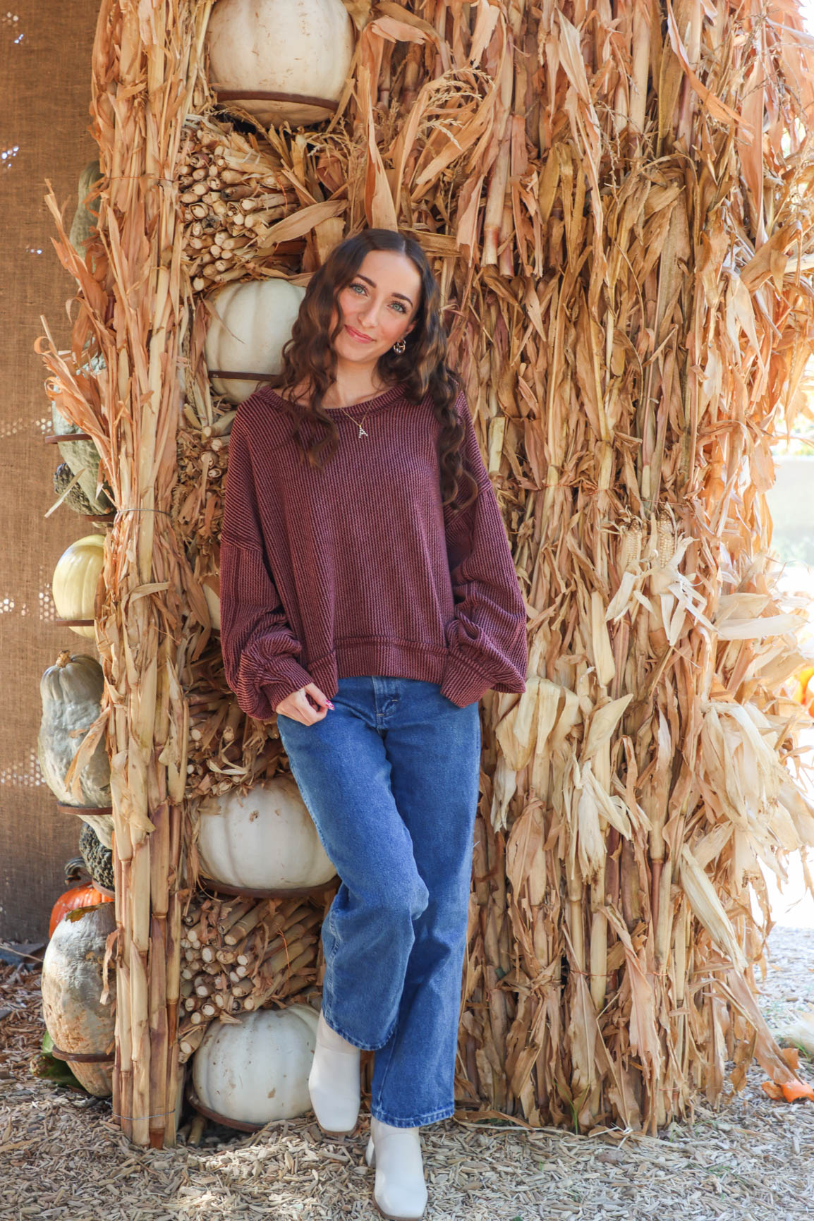 girl wearing dark red ribbed long sleeve top