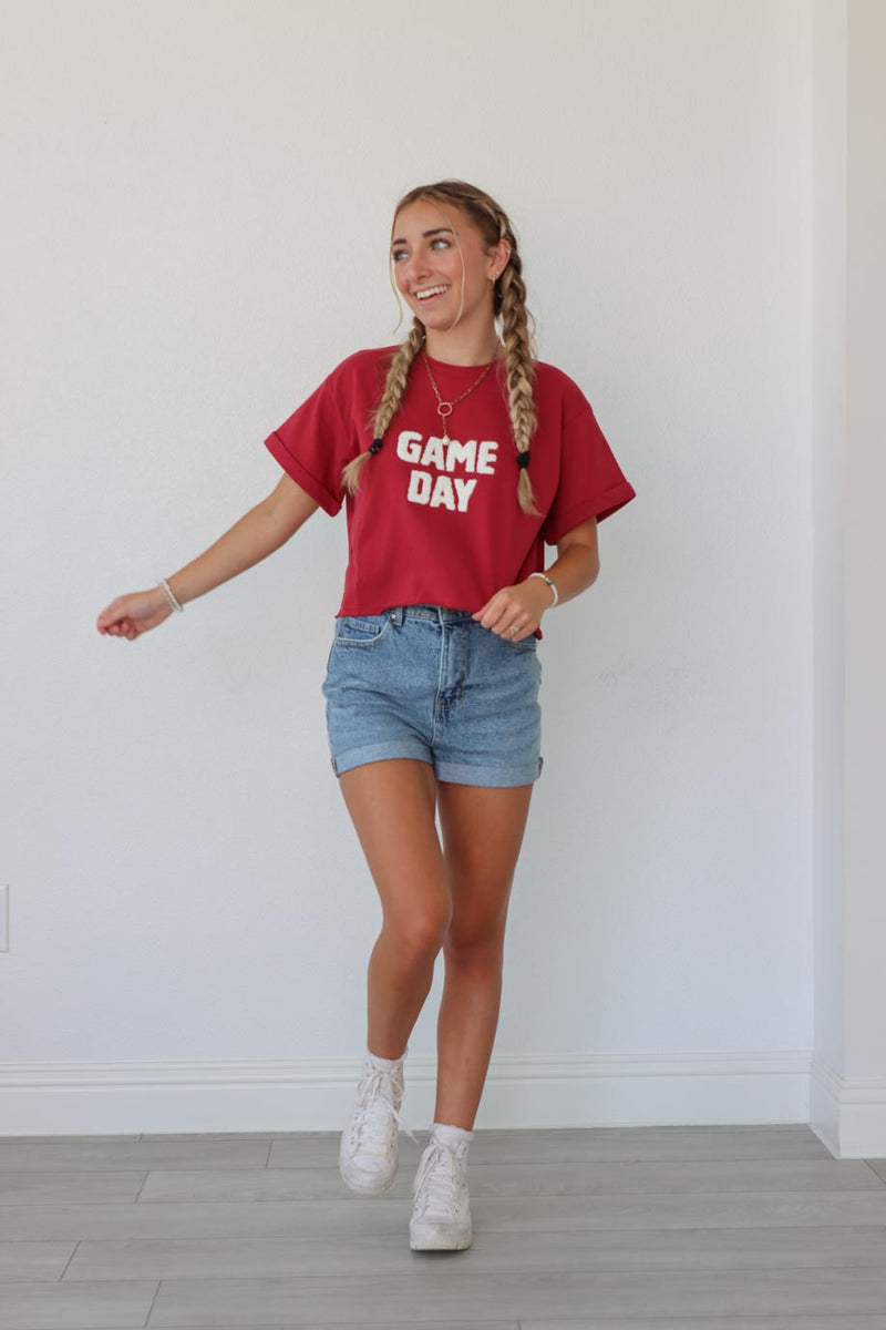girl wearing red "game day" t-shirt