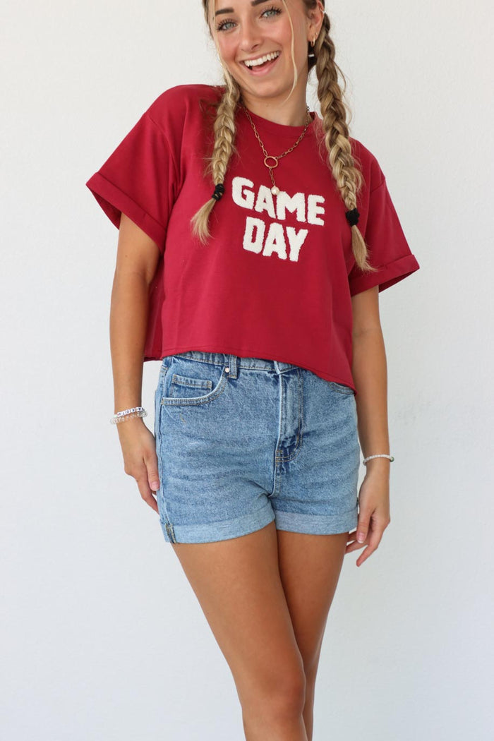 girl wearing red "game day" t-shirt