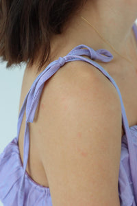 adjustable strap detailing on short purple dress 